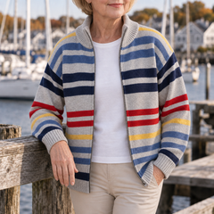 Emmett striped zip cardigan in Grey, leaning on the harbour rail